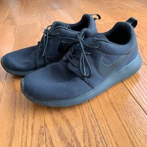 All black Nike sneakers